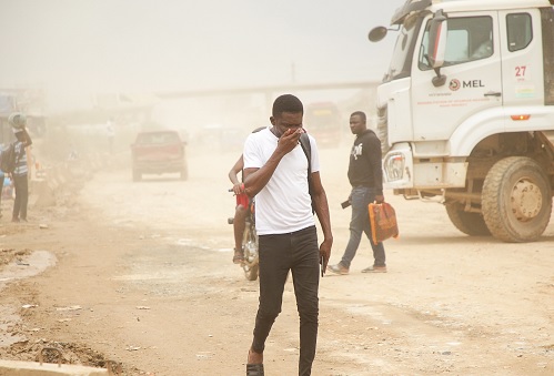 Some members of the travelling public enduring the dusty nature of the road