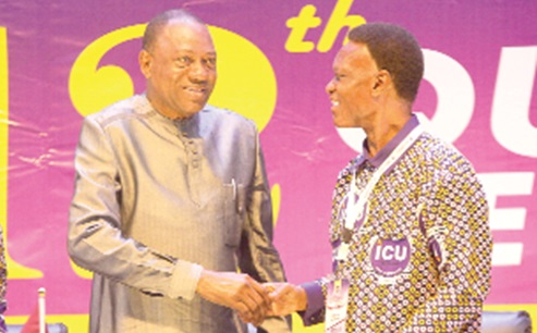 Dr Abdul-Rashid Hassan Pelpuo (left), Minister of Labour, Jobs and Employment, in a handshake with Morgan Ayawine, General-Secretary, ICU-Ghana, at the event. Picture: CALEB VANDERPUYE