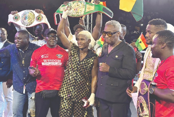 •  Victorious Theophilus Allotey celebrates with promoter Dave Bishop (2nd from right) and veteran trainer Kwasi Ofori Asare (2nd from left) after his triumph over Martin Kouassi Klaklevi