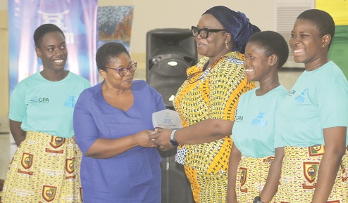 Harriet Adelaide Tagoe (3rd from right), MD, Afram Publications Ltd, presenting the first-place award to Felicia A.A. Bulley (2nd from left), English Teacher, Tema Senior High School, along with the three contestants of the competition. Picture: ESTHER ADJORKOR ADJEI 