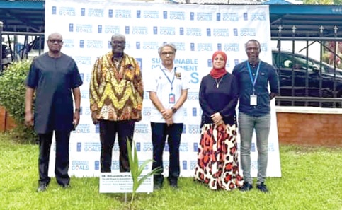 Niloy Banerjee (middle), UNDP Resident Representative, Shaima Hussein (2nd from right), Deputy UNDP Resident Rep, Prosper Bani (left) and Dr Peter Dery (2nd from left), Environmental Director,  Ministry of Environment, Science and Technology, after they had planted the trees