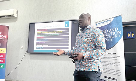Michael Okine, Coordinator, Land and Corruption in Africa Project of Transparency International, explaining a point at the forum