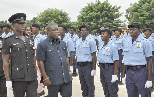 James Gunu (2nd from left), Volta Regional Minister, reviewing the passing out parade under the command of ASP Emmanuel Dedzo