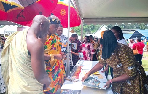 Odeefuo Amoakwa Buadu (2nd from left), President of the Central Regional House of Chiefs, at one of the exhibition booths Odeefuo Amoakwa Buadu (2nd from left), President of the Central Regional House of Chiefs, at one of the exhibition booths