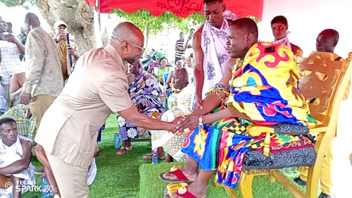Francis Owusu Antwi (left), Bono East Regional Minister, exchanging pleasantries with Okofrobour Awasi Afuri, Dwanhene