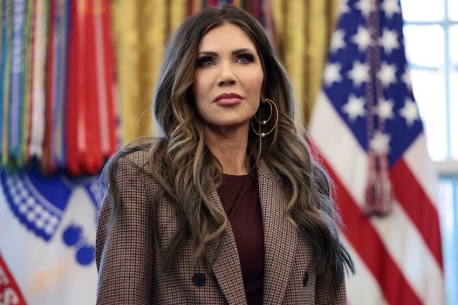 U.S. Homeland Security Secretary Kristi Noem looks on as U.S. President Donald Trump (not pictured) meets with the White House Task Force on the FIFA World Cup 2026 in the Oval Office at the White House in Washington, D.C., U.S., November 17, 2025. REUTERS/Evelyn Hockstein