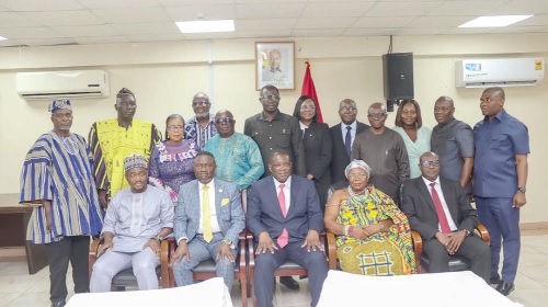 Governs Kwame Agbodza (seated middle), Minister of Roads and Highways, and members of the constituted Board of Trustees of the Road Maintenance Trust Fund after the swearing in. Picture: BENEDICT OBUOBI