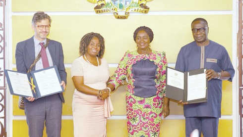 Prof. Naana Jane Opoku-Agyemang (2nd from right), Vice-President, in a handshake with Francia Elena Márquez Mina, Vice-President, Republic of Colombia, and James Gyakye Quayson (right), Deputy Minister of Foreign Affairs, after the signing of the MoU