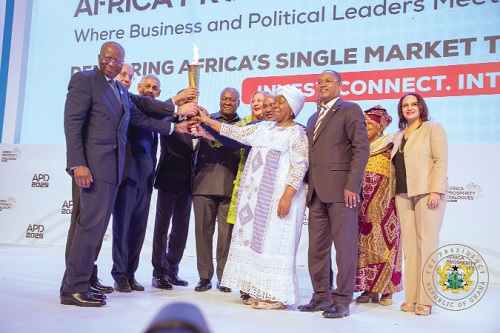 President John Mahama (5th from left) and his colleague Heads of State, President Faure Essozimna Gnassingbé of Togo, President Azali Assoumani of Comoros, and some dignitaries holding the Africa Trade Torch