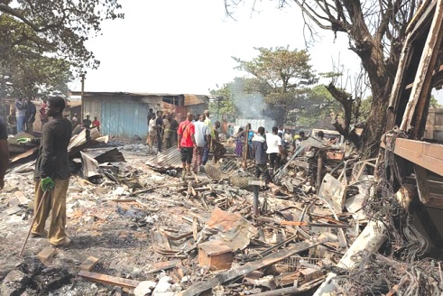 Some victims sifting through the remnants of their goods destroyed by the fire Some victims sifting through the remnants of their goods destroyed by the fire