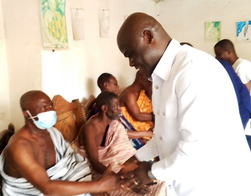 Ahmed Ibrahim, Minister of Local Government, Chieftaincy and Religious Affairs, exchanging pleasantries with members of the Banda Traditional Council