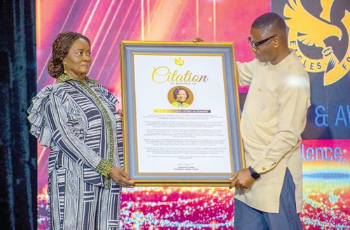 Vice-President Professor Naana Jane Opoku-Agyemang receiving a citation from a member of the Eagle Forum