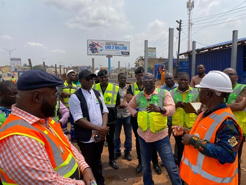The Director-General of the NRSA, Abraham Amaliba, interacting with some stakeholders in the road safety space during an inspection tour of some footbridges.