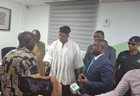  Joseph Bukari Nikpe (in smock), Minister of Transport, interacting with some staff of the DVLA during the visit to the authority