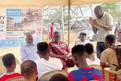 Michael Adotey Codjoe (standing), Chairman of the Greater Accra Branch 4, addressing the  artisans at Bawaleshie