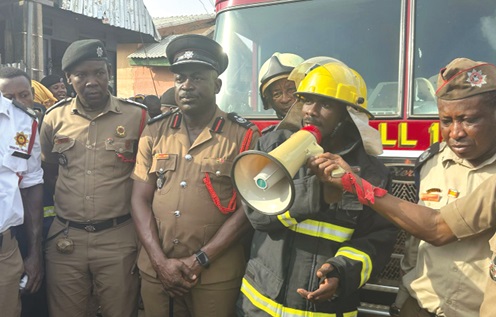 ADO I Imran Iddrisu (with megaphone), Wa Municipal Fire Officer, addressing the traders at the market. On his right is ACFO II Isaac K. Obosu,  the Regional Fire Officer