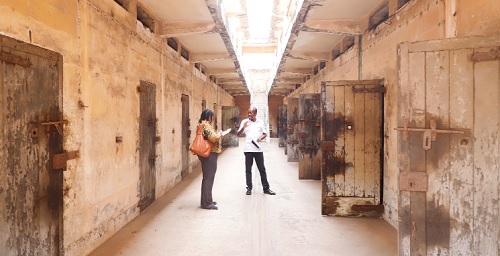Mr Benjamin Afagbegee (right), Senior Conservator of Monuments explaining to Doreen Hammond, Editor of The Mirror, features of the prison architecture, during a tour of the facility Mr Benjamin Afagbegee (right), Senior Conservator of Monuments explaining to Doreen Hammond, Editor of The Mirror, features of the prison architecture, during a tour of the facility