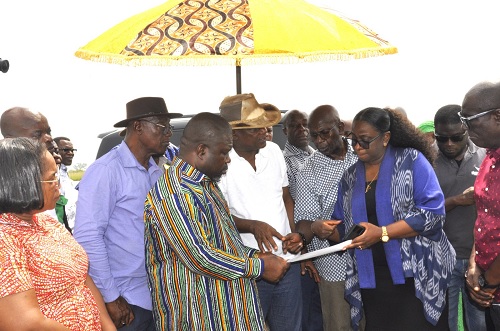 James Gunu (3rd from left), Volta Regional Minister, Togbe Afede XIV (4th from left), founder of AWA, Yvonne Nana Afriyie Opare (2nd from right), MD, GACL, and other officials examining the project site plan 