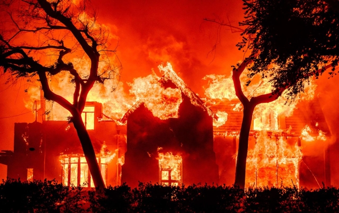 Helicopters are seen making water drops over the Sunset fire on January 8. AaronP/Bauer-Griffin/GC Images/Getty Images