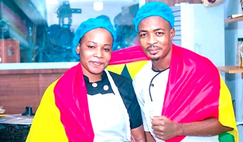 Chef Failatu and Chef Malik Eric, her kitchen assistant, beaming with smiles in the kitchen during the  cooking marathon attempt in Tamale