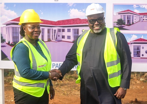 Prof. Nana Aba Appiah Amfo (left), Vice-Chancellor of the University of Ghana, in a handshake with Kofi Adomakoh, Managing Director of GCB Bank PLC. Picture: CALEB VANDERPUYE 