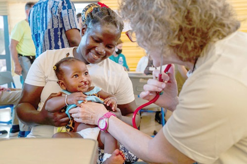 A  medical officer attending to a beneficiary of cleft lip and palate surgery  at the Greater Accra Regional Hospital. Picture: ESTHER ADJORKOR ADJEI 