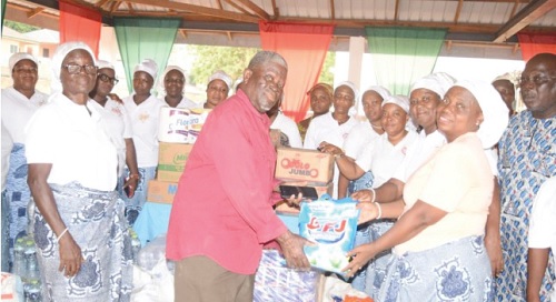  A representative of the inmates of the Weija Leprosarium receiving the items presented by the Women’s Society of the AME Zion Church