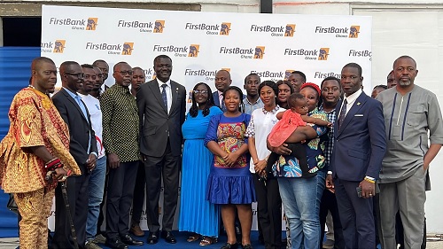 Victor Yaw Asante, MD/CEO of FirstBank Ghana, with some staff and customers