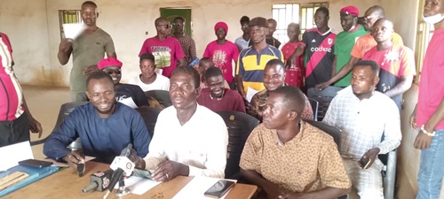 David Uwumborkan Nalibey (middle) addressing the news conference. With him is a section of the NDC youth of Nkwanta-North