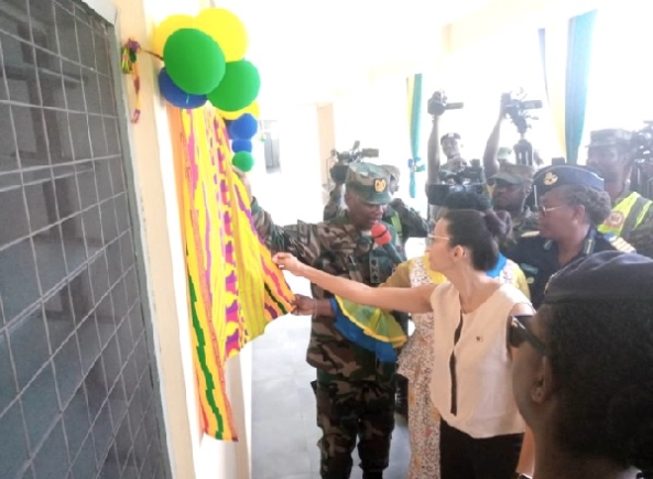 Brig Gen Samuel Yeboah Asare, General Officer Commanding, Southern Command, being assisted by Afua Ansere, representing Elsie Initiative Fund, and Elsa Mouelhi-Rondeau, Counsellor at the Canadian High Commission in Ghana in charge of Political and Public Affairs, to unveil a plaque to officially inaugurate the facility. INSET: The 200-bed accommodation facility