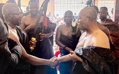 Akyemfuo Asiedu Agyeman III (right), Abetifihene and Adontenhene of the Kwahu Traditional Area, congratulating Daasebre Akuamoah Boateng III, Omanhene of the Kwahu Traditional Area, after handing over the staff of power to him. Picture: CALEB VANDERPUYE