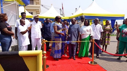 Sandra Opoku (arrowed), Director of Port, assisting Gordon Anim and his family to cut the tape to officially christen the craft