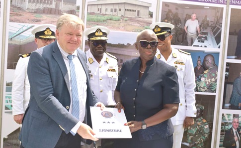 Marietta Agyeiwaa Brew (right), Legal Counsel to the President, receiving the simulation centre’s documents from Tom Norring, the Danish Ambassador to Ghana