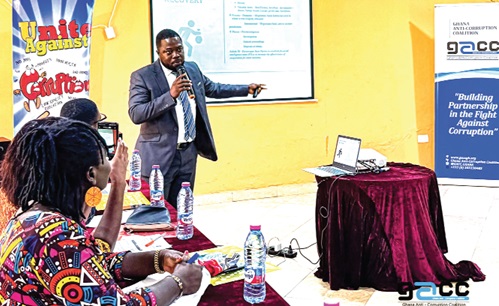 Raphael Asamoah, an officer at the Financial Intelligence Centre, making a presentation at one of the training programmes in the Western Region