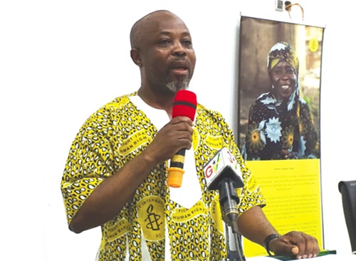Francis Nyantakyi (left), Board Chairman, Amnesty International Ghana, addressing the meeting