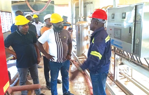 The shea factory. inset: Abudu Issahaku (right), the Assistant Plant Engineer of PBC Shea, briefing Dr Peter Boamah Otokunor (middle), Director of Presidential Initiatives in Agriculture and Agribusiness