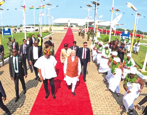 President John Mahama ushering in Narendra Modi, the Indian Prime Minister, to the arrival hall of the Kotoka International Airport in Accra