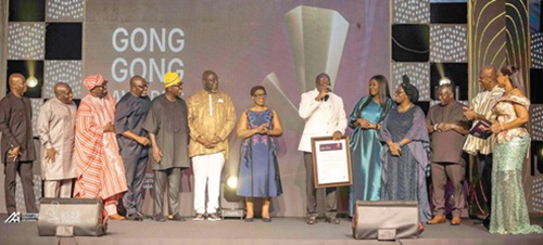 Francis Dadzie (middle), former Executive Director of the Advertising Association of Ghana, flanked by his wife, executive members of the AAG and some marketing gurus, speaking after receiving his award