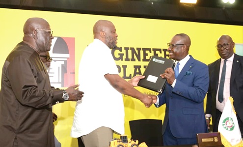 Dr George Agyekum Donkor (2nd from right), President and Chairman of the Board of Directors,  EBID, exchanging the agreement with Ibrahim Mahama (middle), Founder, Engineers and Planners, at the signing ceremony. With them are Sir Sam Jonah and an executive from EBID