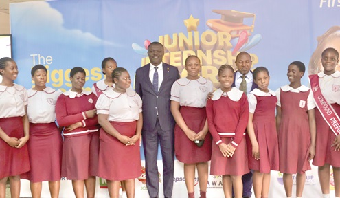 Victor Yaw Asante (5th from left), CEO, FirstBank Ghana, and some pupils of the Christ the King International School at the launch