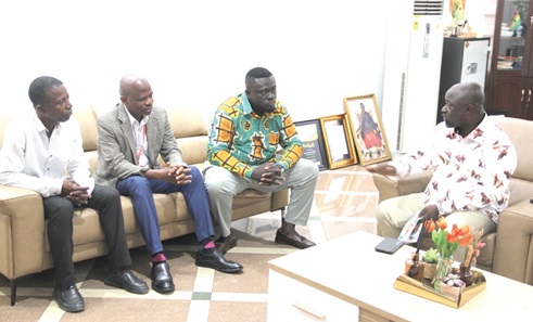 Richard Ofori-Agyeman Boadi (right), Kumasi Municipal Chief Executive, explaining a point to the Graphic delegation led by Benjamin Tsatsu Korsinah (3rd from left), Graphic Zonal Business Manager