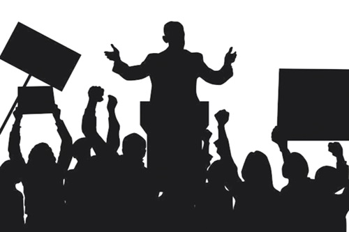 A silhouette of a democratic leader speaking to protesters