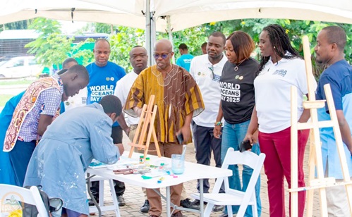 Prof Nana Ama Browne Klutse (2nd from right), CEO of EPA, with some dignitaries observing students displaying their artworks