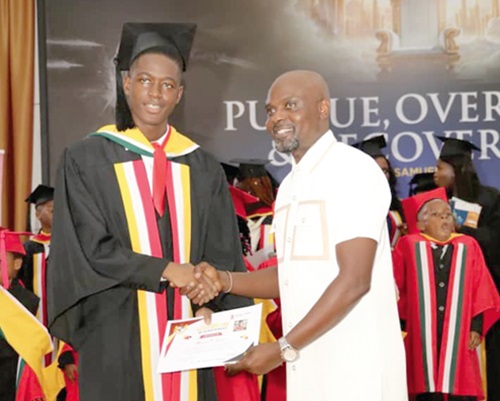 Mastin Tamba Saah (left), Ghana 2025 Valedictorian, British Columbia College, receiving his certificate from Paul Dovi, PTA Chairman