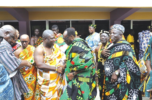 Togbe Tepre Hodo IV (in spectacles), President of the Volta Regional House of Chiefs, in a hearty handshake with James Gunu, Volta Regional Minister, after the meeting