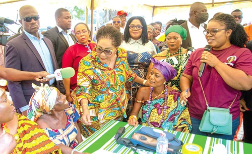 Frist Lady Lordina Mahama (arrowed) speaking with some of the beneficiaries during the health screening