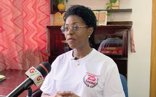 A staff member of Patholab (right) attending to a member of staff of Adabraka Cluster of Schools. INSET: Elizabeth-Irene Baitie, CEO of Patholab Solutions Medical Laboratory, speaking during the interview