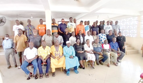 Justice Mensah-Homiah (seated 5th from right), a justice of the Court of Appeal, with various transport union members and drivers in Koforidua