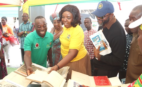 Dr Evans Aggrey-Darkoh (left), the Head of the Civil Service, and Wilhelmina Asamoah (middle), the Chief Director, Ministry of Sports and Recreation, going through a diary of Dr Kwame Nkrumah which is being exhibited by the Public Records and Archives Administration Department. Picture: ELVIS NII NOI DOWUONA 