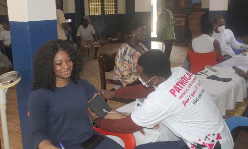 A staff member of Patholab (right) attending to a member of staff of Adabraka Cluster of Schools A staff member of Patholab (right) attending to a member of staff of Adabraka Cluster of Schools